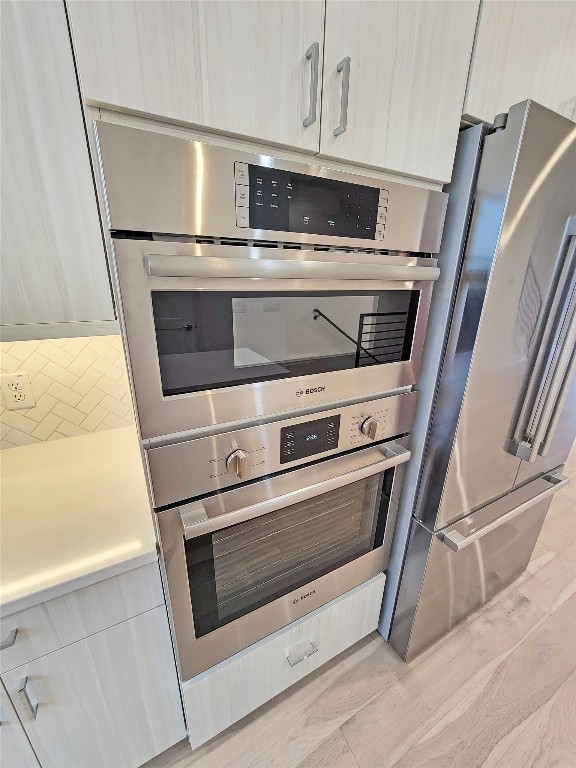 3807 Threadgill Street Austin, TX 78723 - Photo 8 of 36 a stove top oven sitting inside of a kitchen