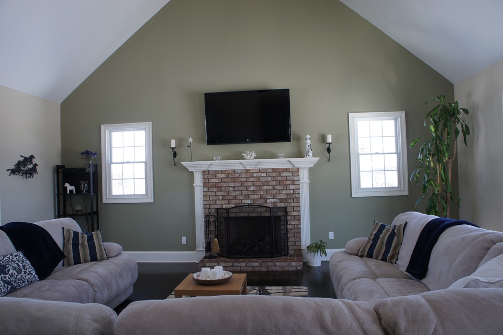 49 Haynes Hill Road Brimfield, MA 01010 - Photo 8 of 27 a living room with furniture a flat screen tv and a fireplace