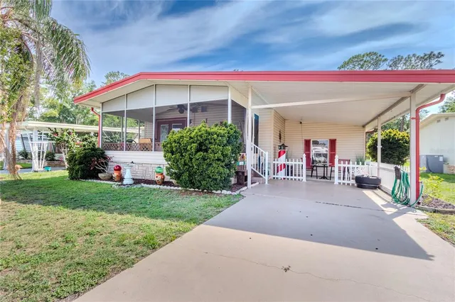 a front view of house with yard and outdoor seating
