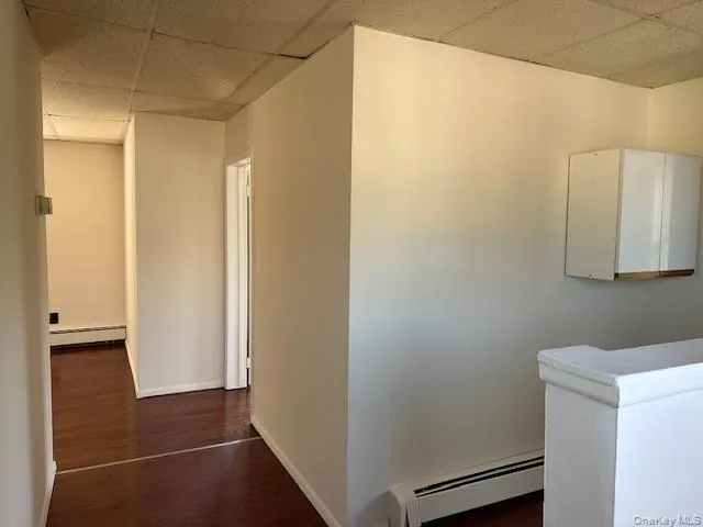 a bathroom with a shower and a sink