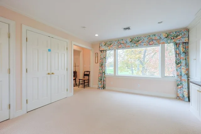 a view of a room with large windows