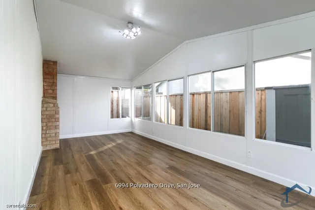 a view of wooden floor and staircase in a room