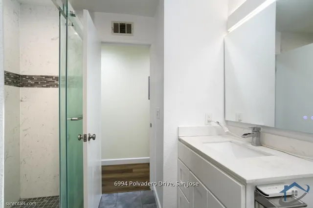 a bathroom with a sink and a mirror