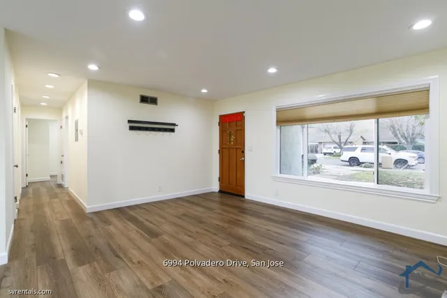 a view of livingroom with furniture wooden floor and window