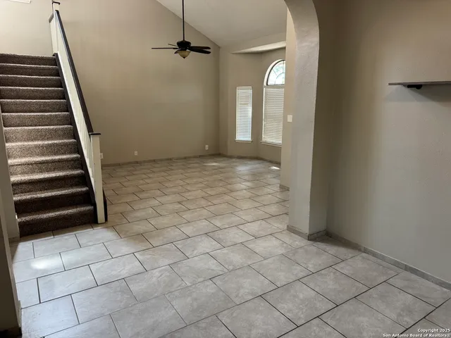 wooden floor in a hall with a window