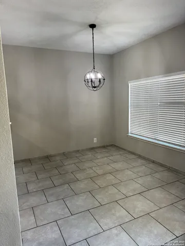 a view of a room with window and a table