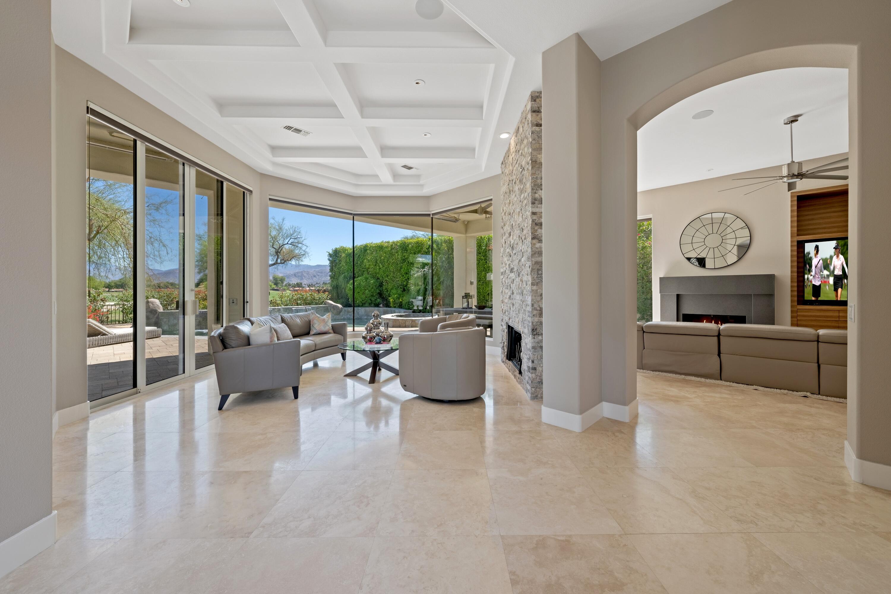 306 Loch Lomond Road Rancho Mirage, CA 92270 - Photo 11 of 60 a living room with furniture and a large window