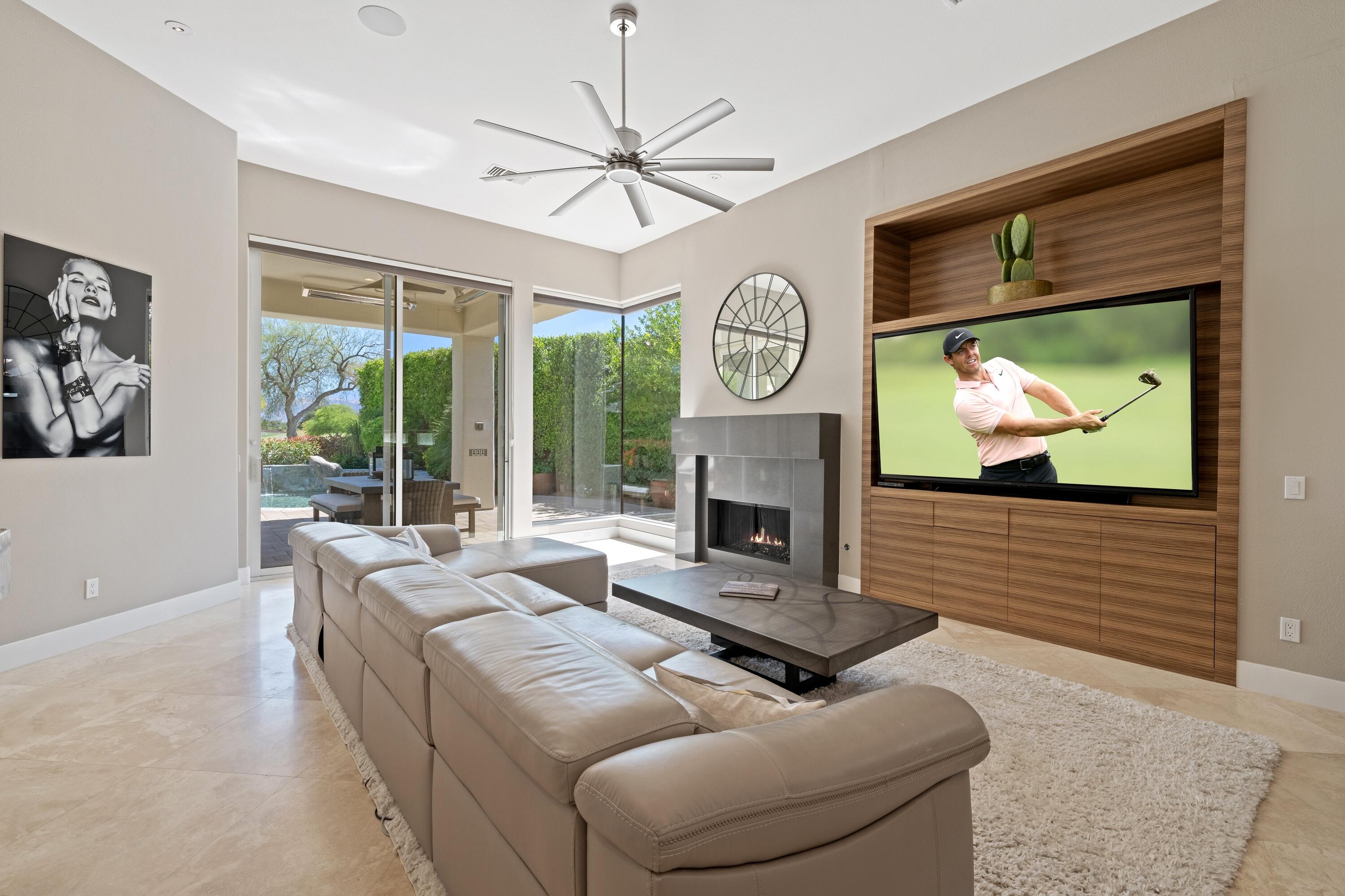 306 Loch Lomond Road Rancho Mirage, CA 92270 - Photo 13 of 60 a living room with furniture a large window and a fireplace