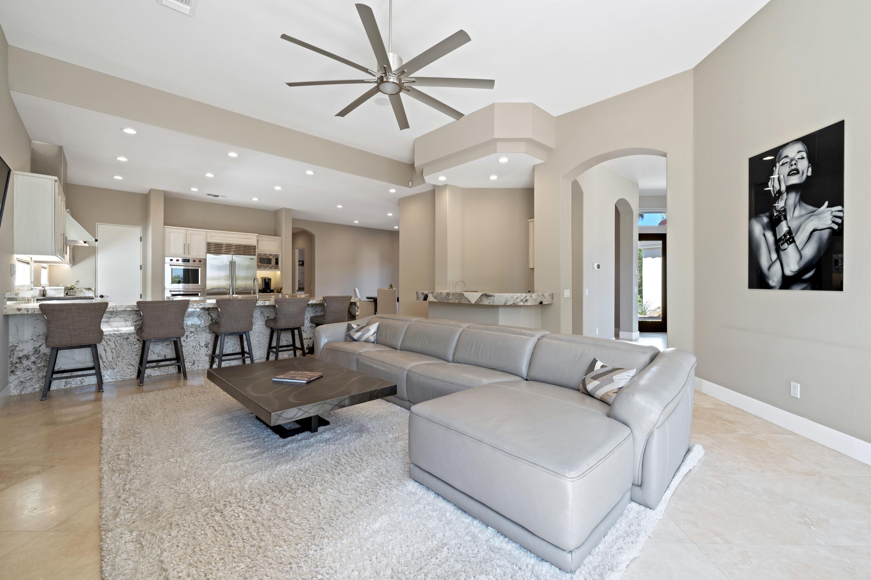 306 Loch Lomond Road Rancho Mirage, CA 92270 - Photo 15 of 60 a living room with furniture kitchen view and a chandelier