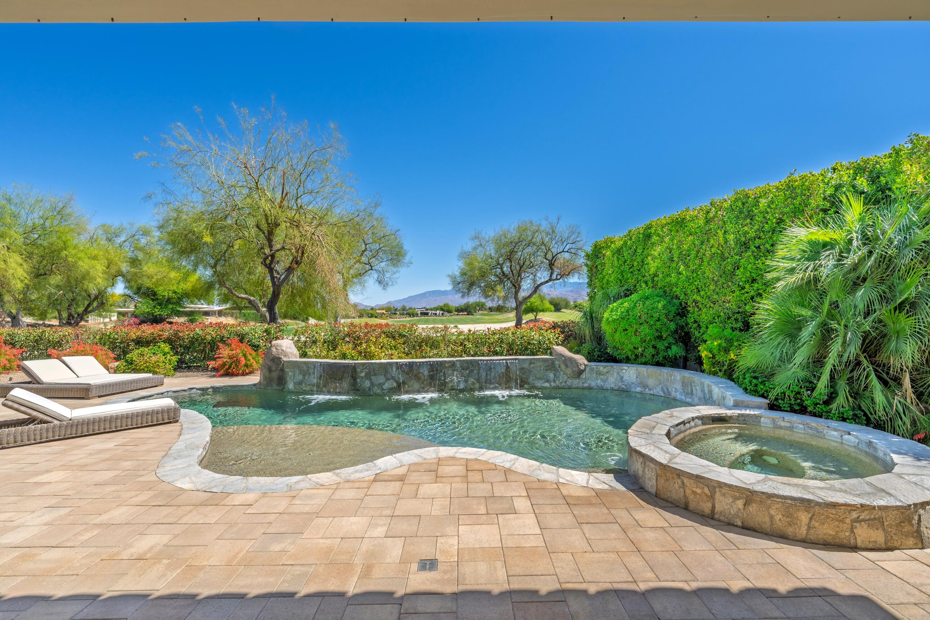 306 Loch Lomond Road Rancho Mirage, CA 92270 - Photo 2 of 60 a view of a swimming pool with a garden