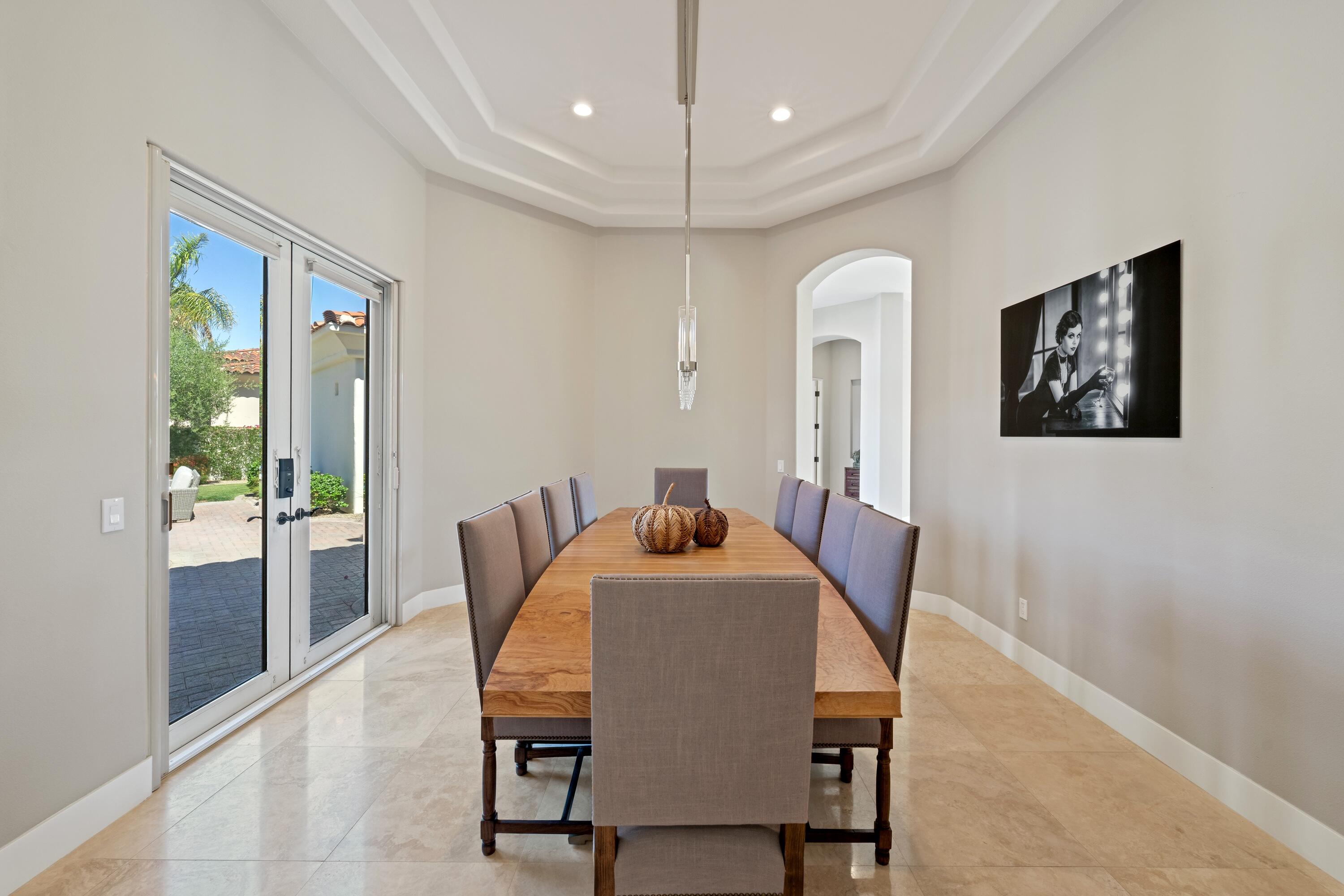 306 Loch Lomond Road Rancho Mirage, CA 92270 - Photo 23 of 60 a dining room with furniture and window