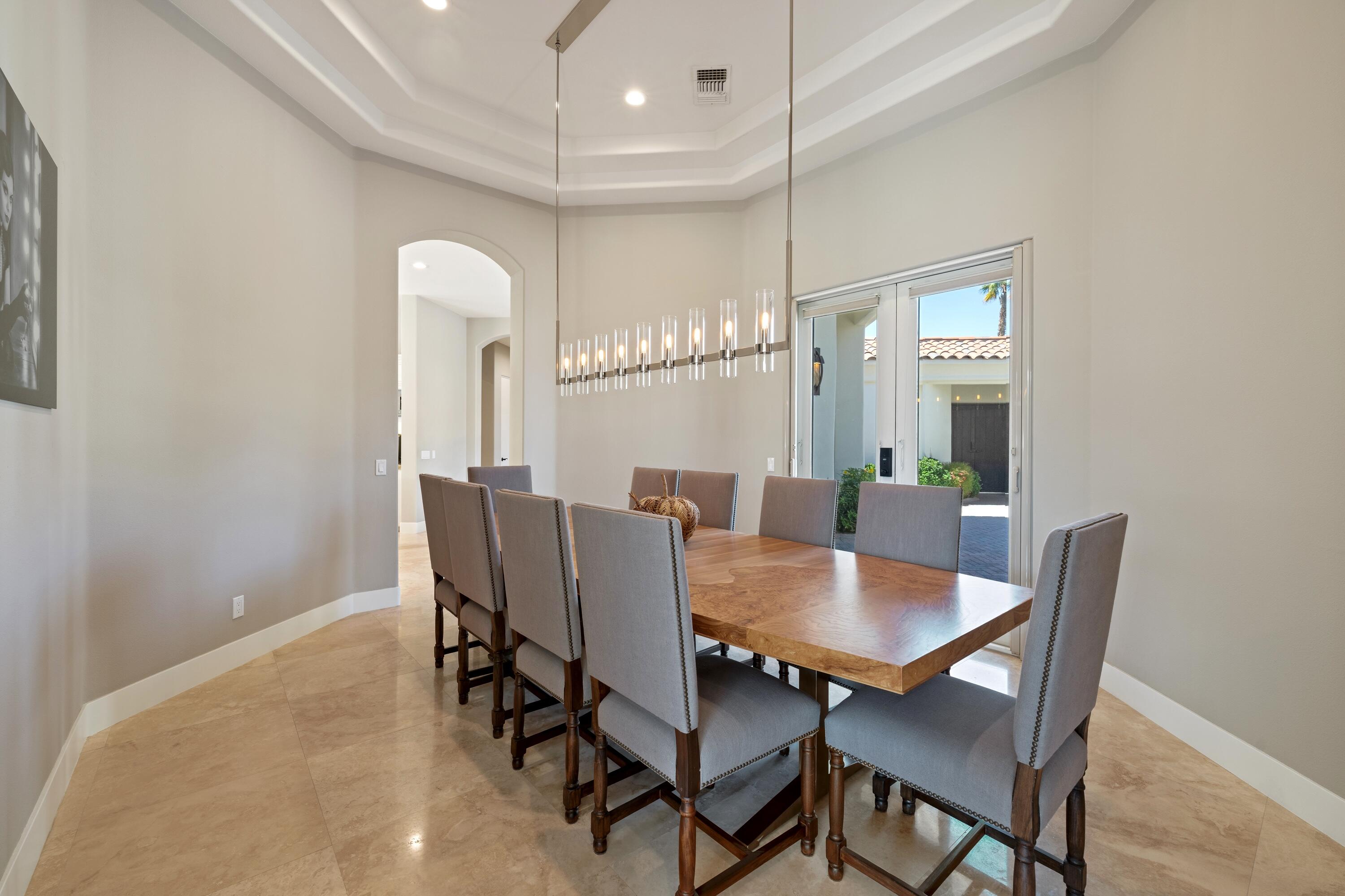 306 Loch Lomond Road Rancho Mirage, CA 92270 - Photo 24 of 60 a view of a dining room with furniture