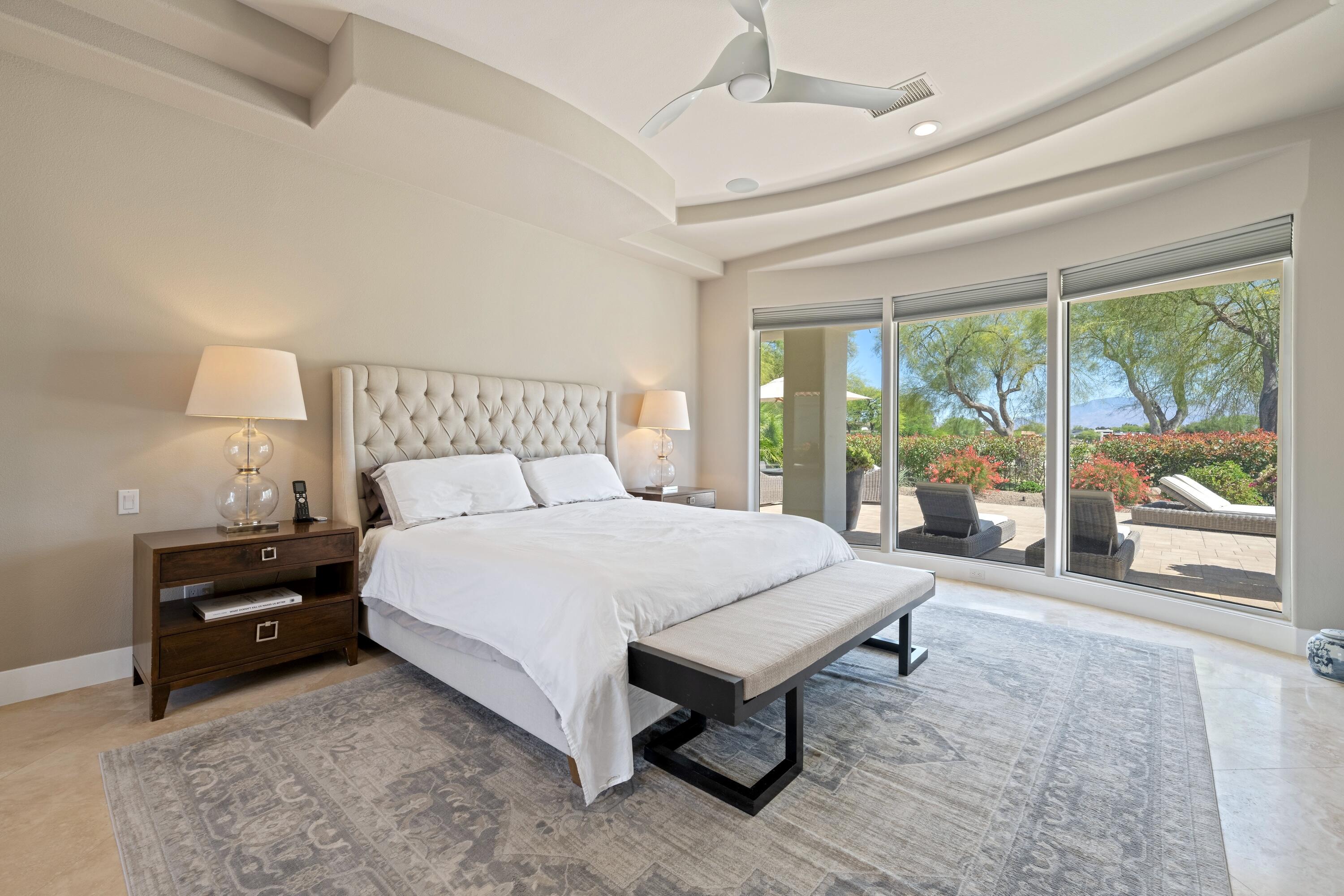 306 Loch Lomond Road Rancho Mirage, CA 92270 - Photo 25 of 60 a bed sitting in a spacious bedroom next to a window