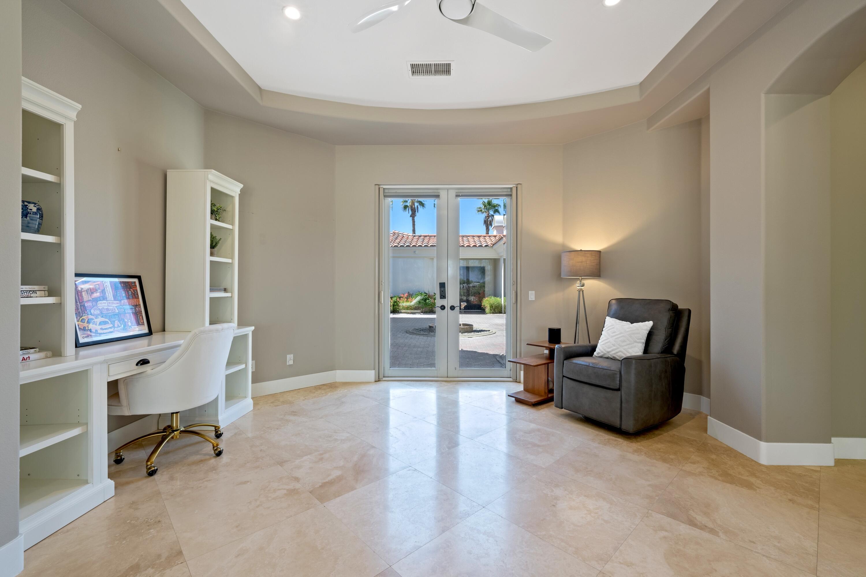 306 Loch Lomond Road Rancho Mirage, CA 92270 - Photo 27 of 60 a living room with furniture and a painting on the wall