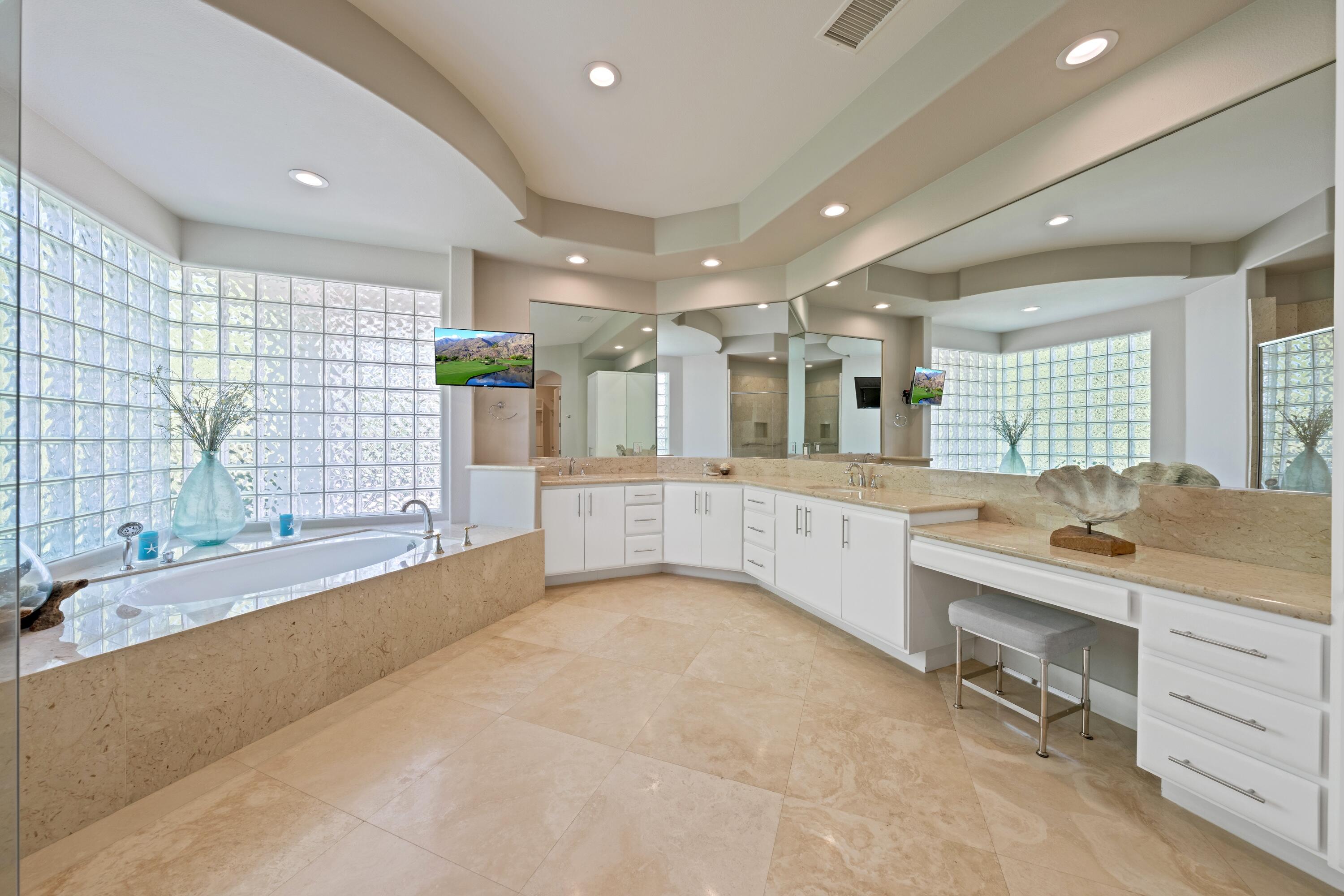 306 Loch Lomond Road Rancho Mirage, CA 92270 - Photo 29 of 60 a large white kitchen with a large window