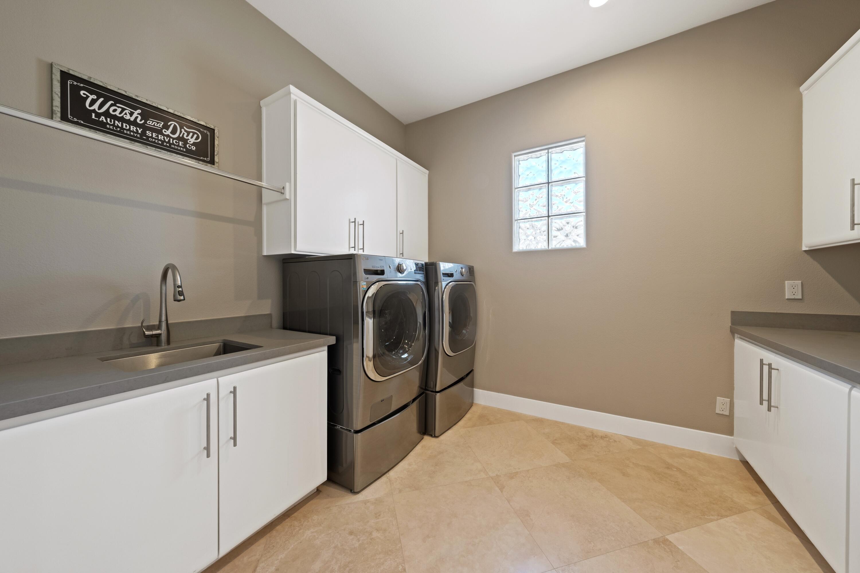 306 Loch Lomond Road Rancho Mirage, CA 92270 - Photo 36 of 60 a kitchen with appliances cabinets and a sink
