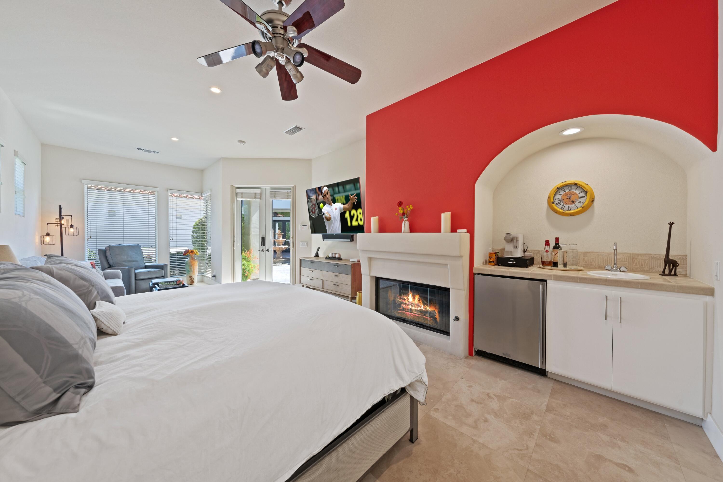 306 Loch Lomond Road Rancho Mirage, CA 92270 - Photo 39 of 60 a large white kitchen with a stove and a fireplace
