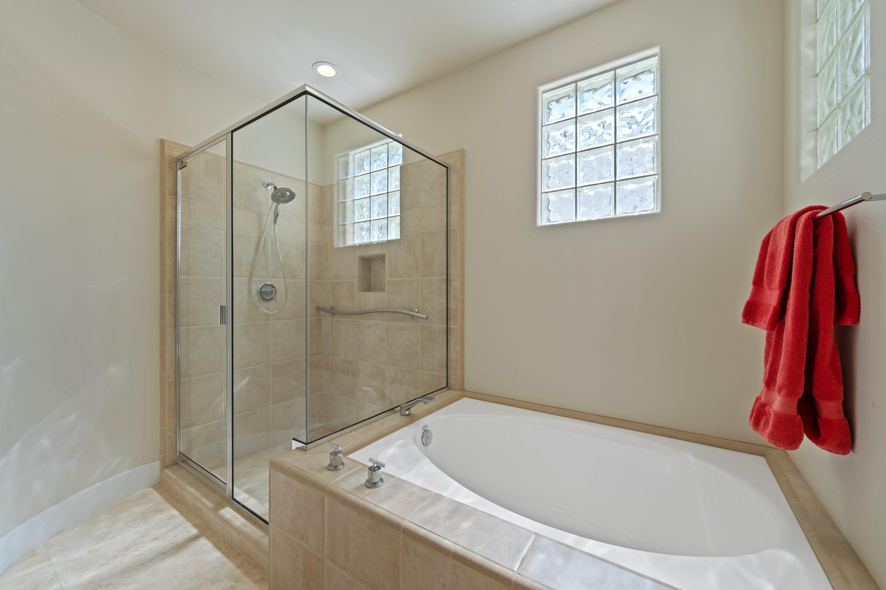306 Loch Lomond Road Rancho Mirage, CA 92270 - Photo 41 of 60 a bathroom with a tub and a shower