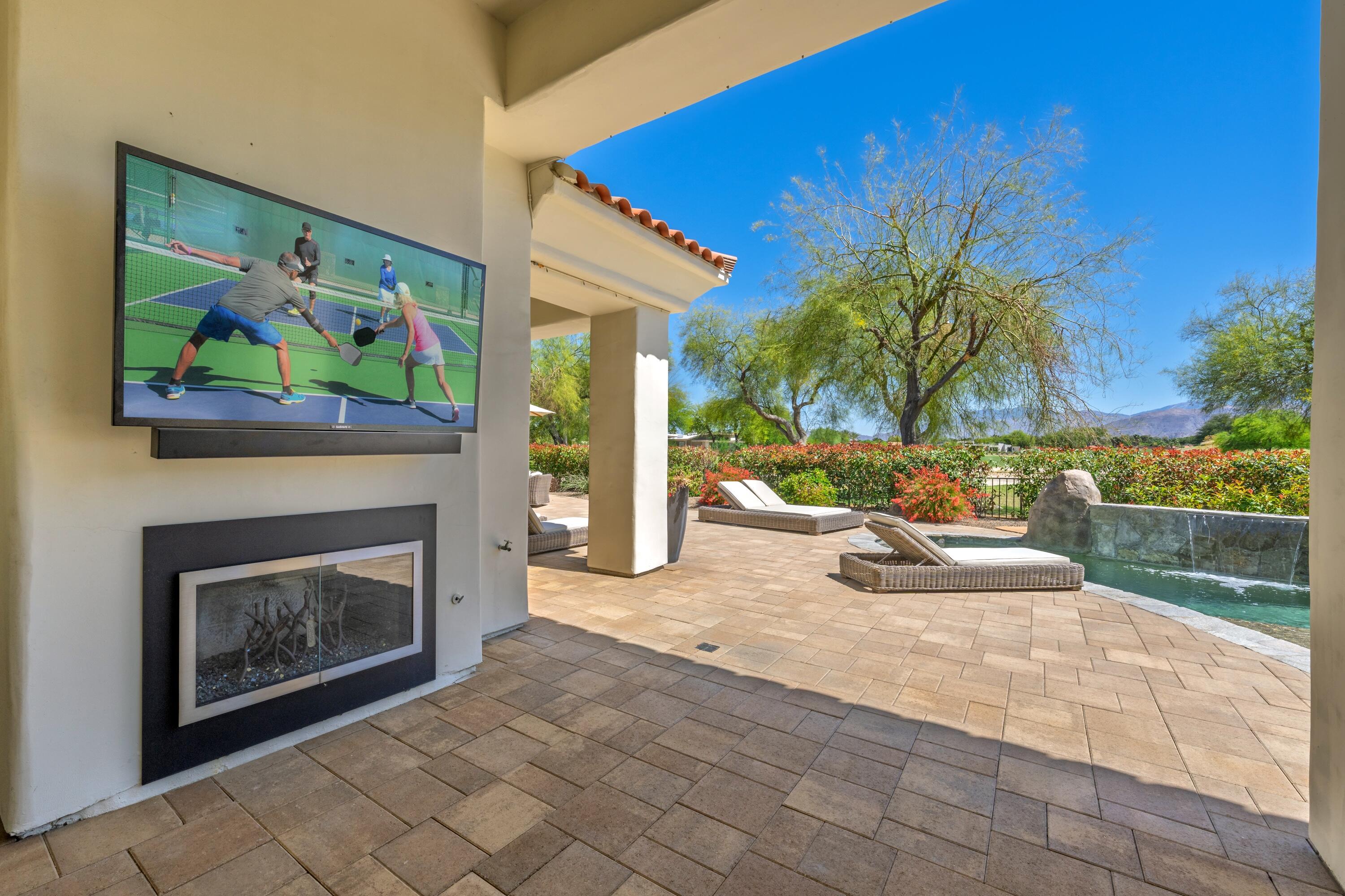 306 Loch Lomond Road Rancho Mirage, CA 92270 - Photo 46 of 60 a view of a livingroom with furniture and a fireplace