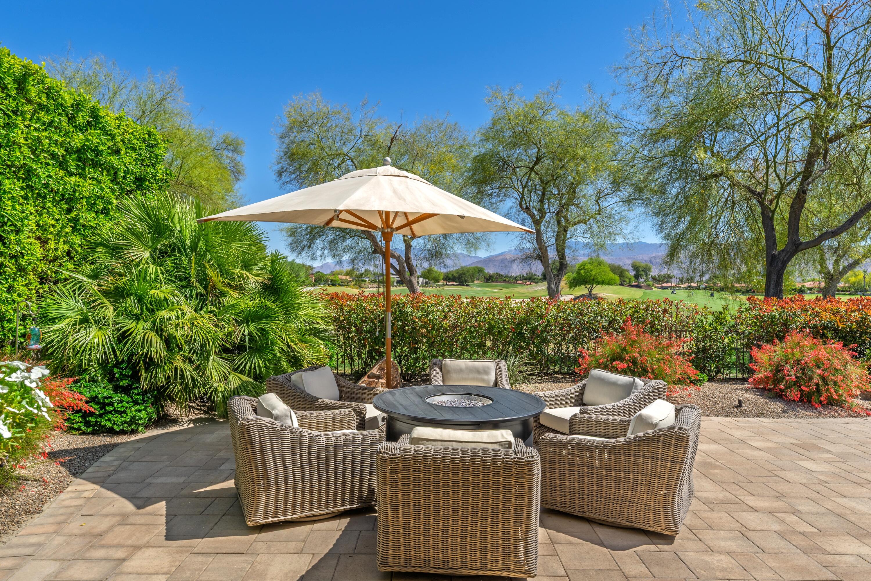 306 Loch Lomond Road Rancho Mirage, CA 92270 - Photo 49 of 60 a view of a patio with couches and potted plants