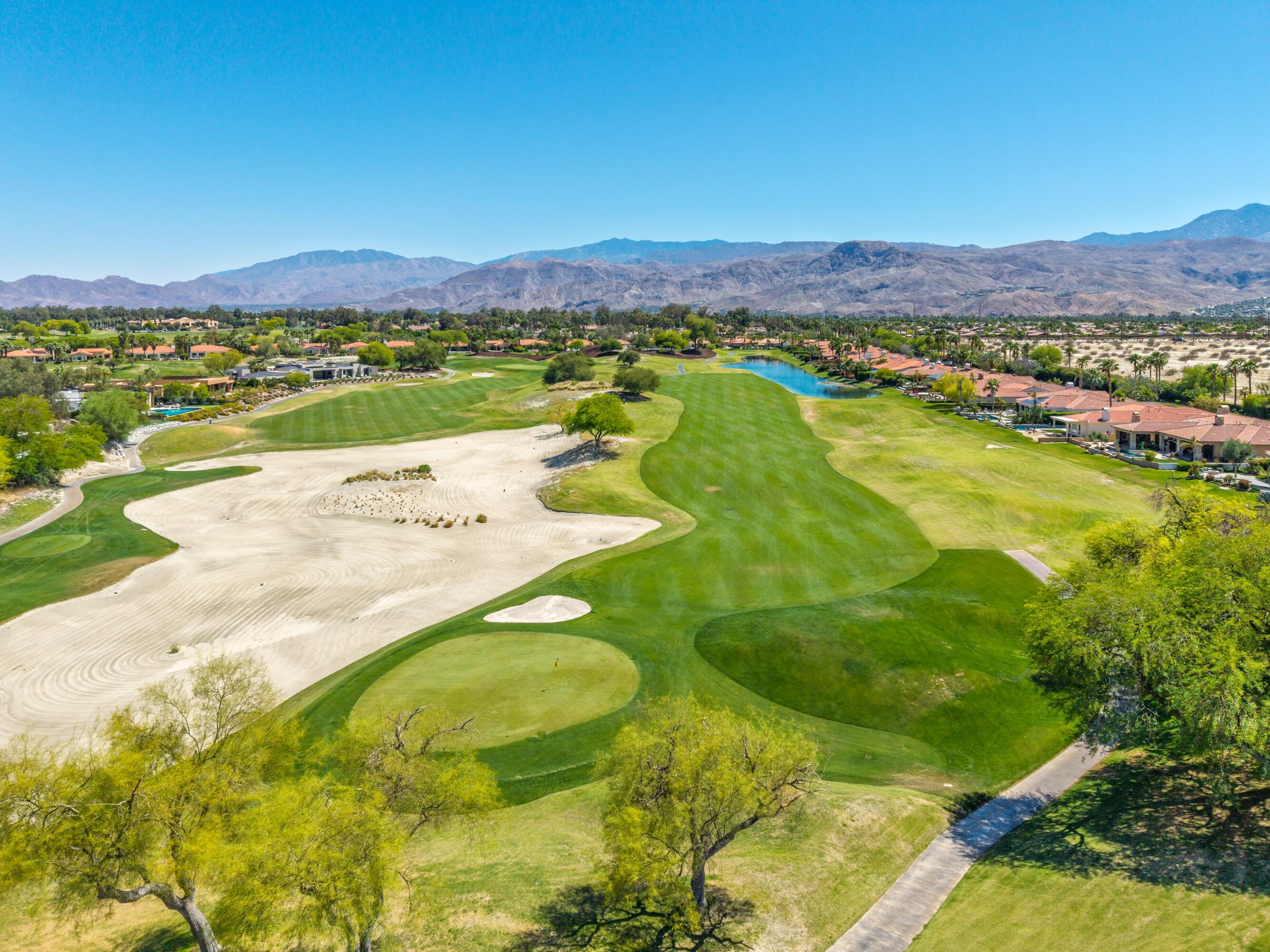 306 Loch Lomond Road Rancho Mirage, CA 92270 - Photo 56 of 60 a view of a lake with a mountain