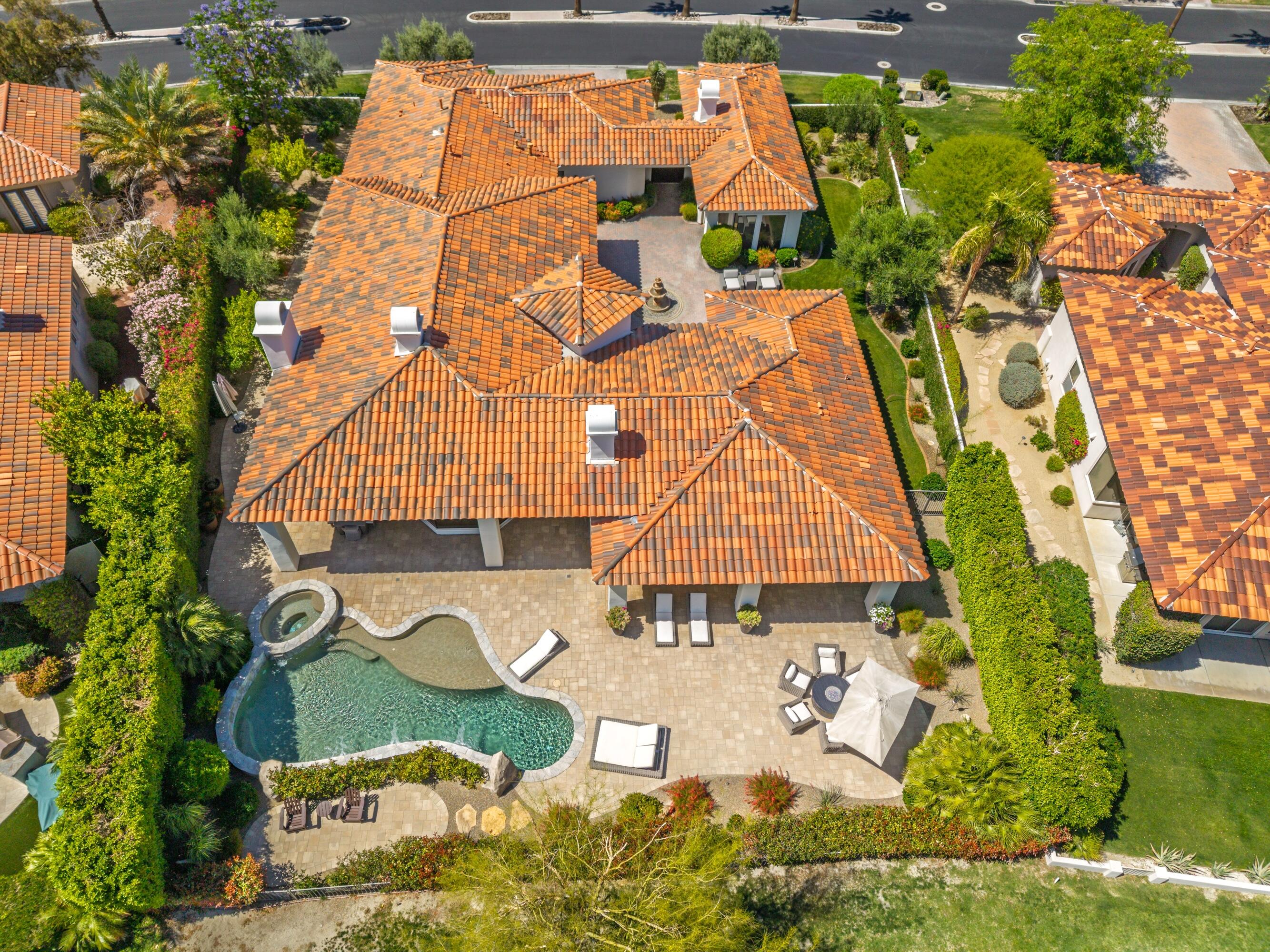 306 Loch Lomond Road Rancho Mirage, CA 92270 - Photo 58 of 60 an aerial view of a house with a yard and potted plants