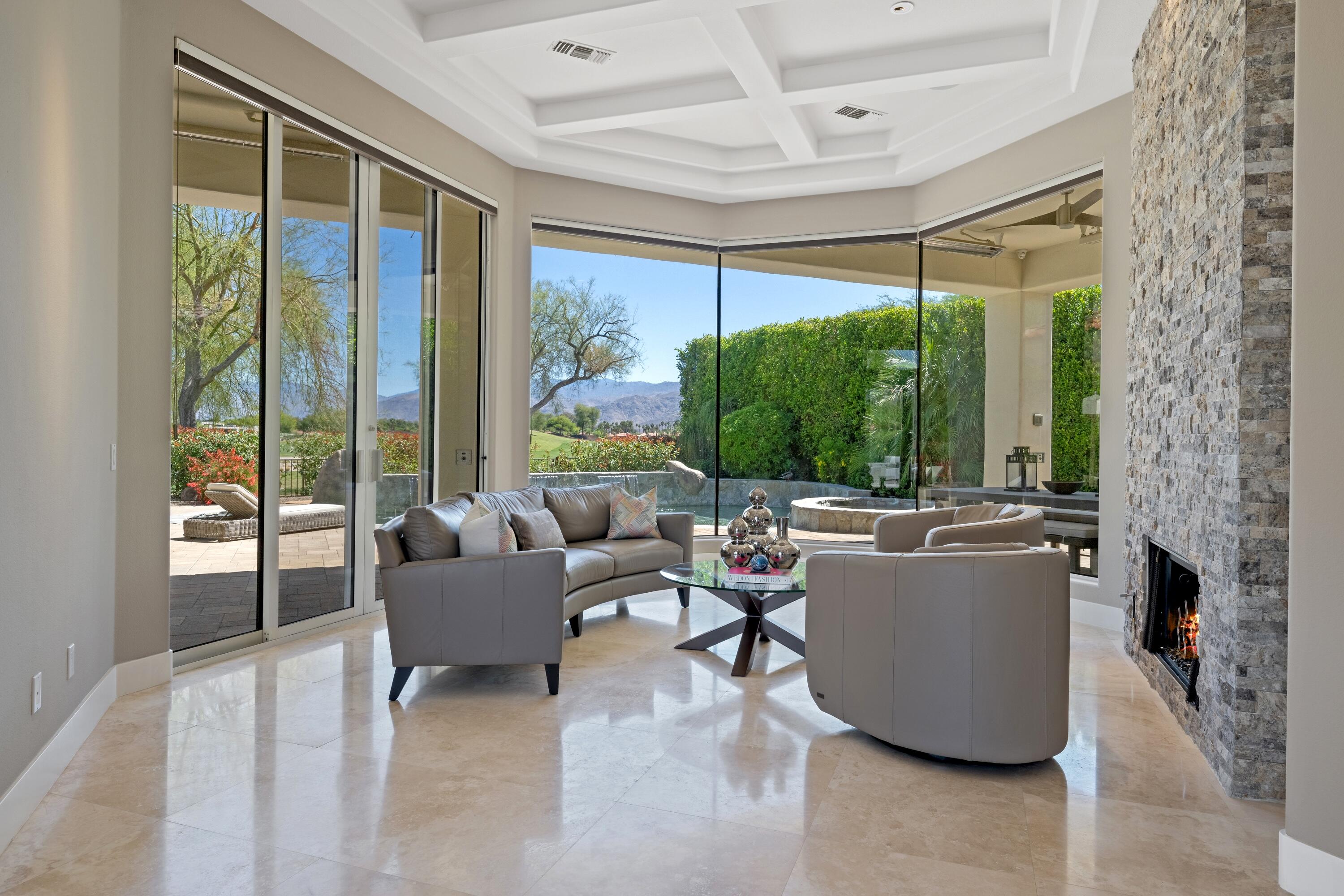 306 Loch Lomond Road Rancho Mirage, CA 92270 - Photo 9 of 60 a living room with furniture and a large window