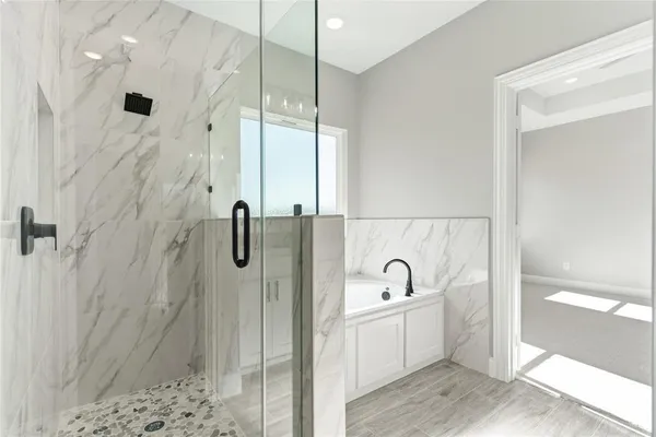 a bathroom with a sink a mirror and shower