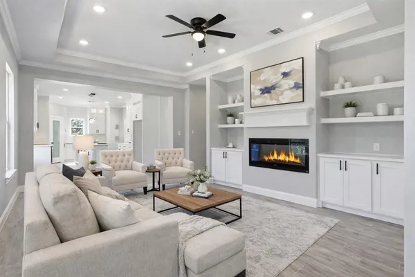 a living room with furniture and a fireplace