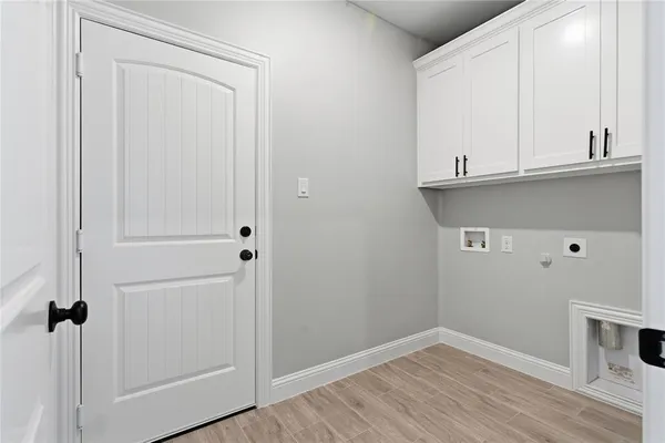 a view of a kitchen with wooden floor