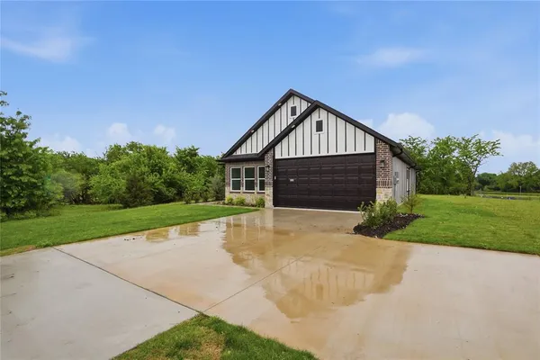 a front view of a house with yard