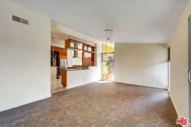 a dining room with large window
