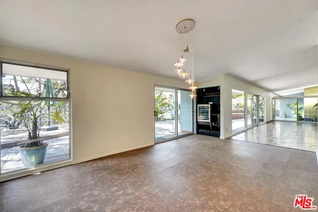 a kitchen with granite countertop a sink and a refrigerator
