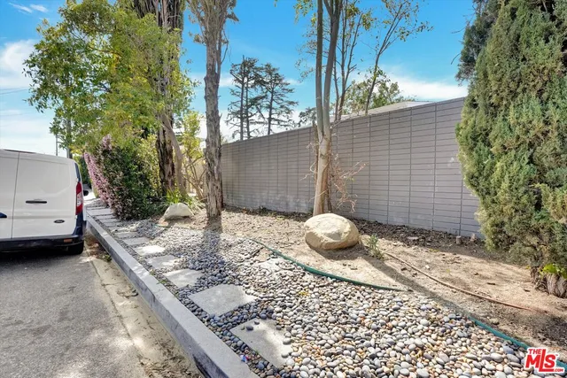 front view of a house with a garden