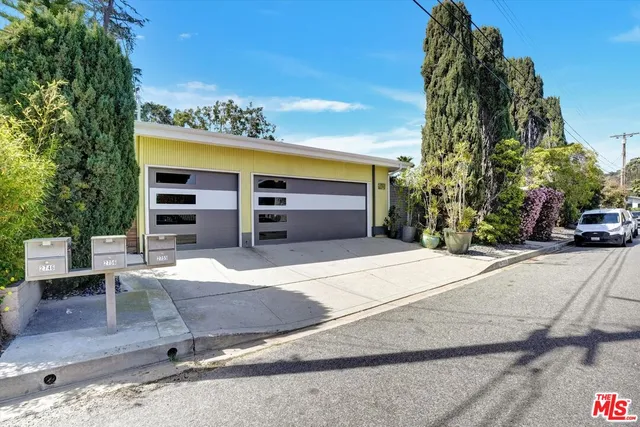 a view of the house with a potted plant