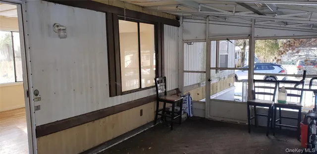 a outdoor room with chairs