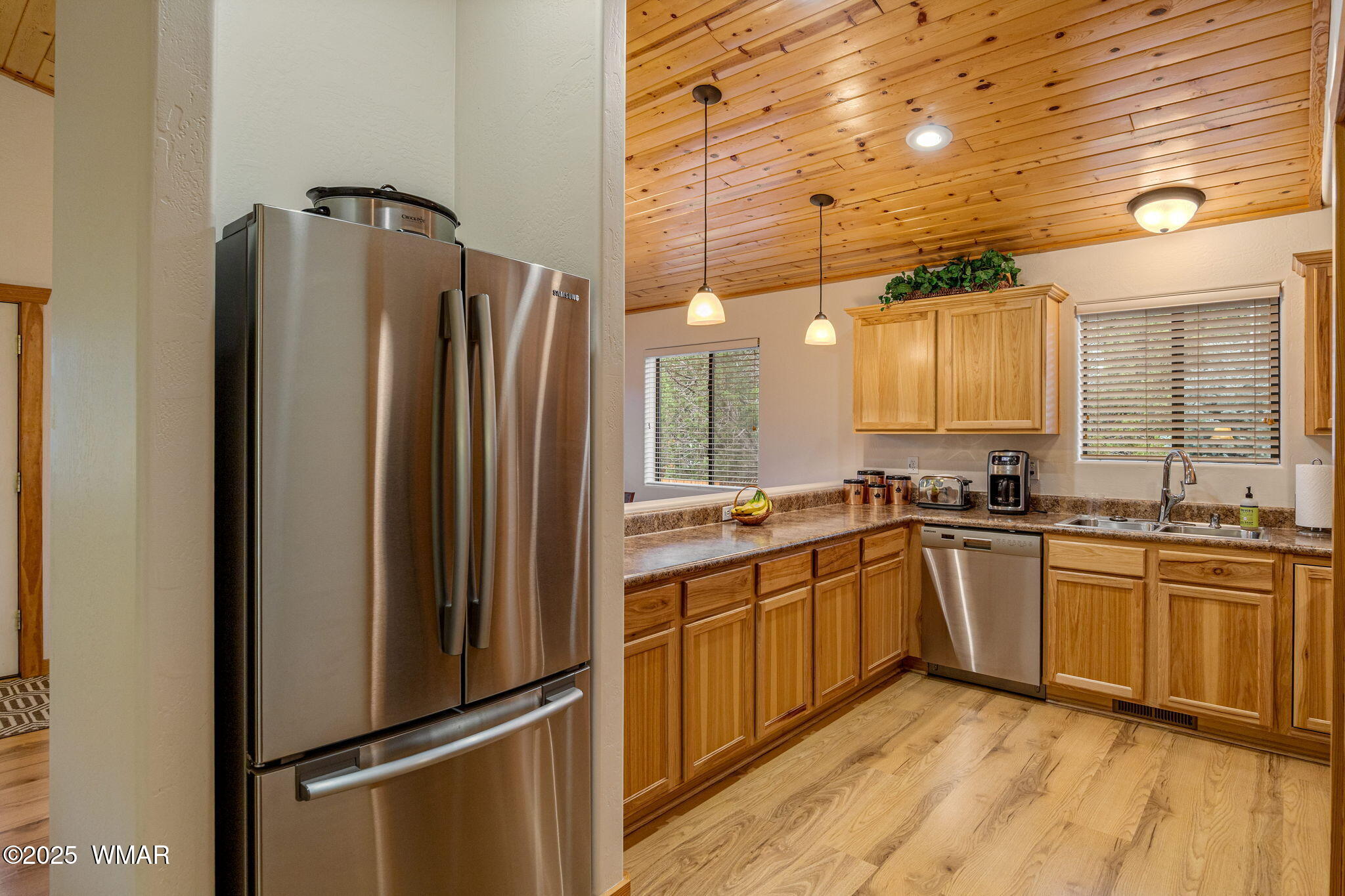 3142 Ranch Road Overgaard, AZ 85933 - Photo 12 of 35 a kitchen with stainless steel appliances granite countertop a refrigerator and a sink