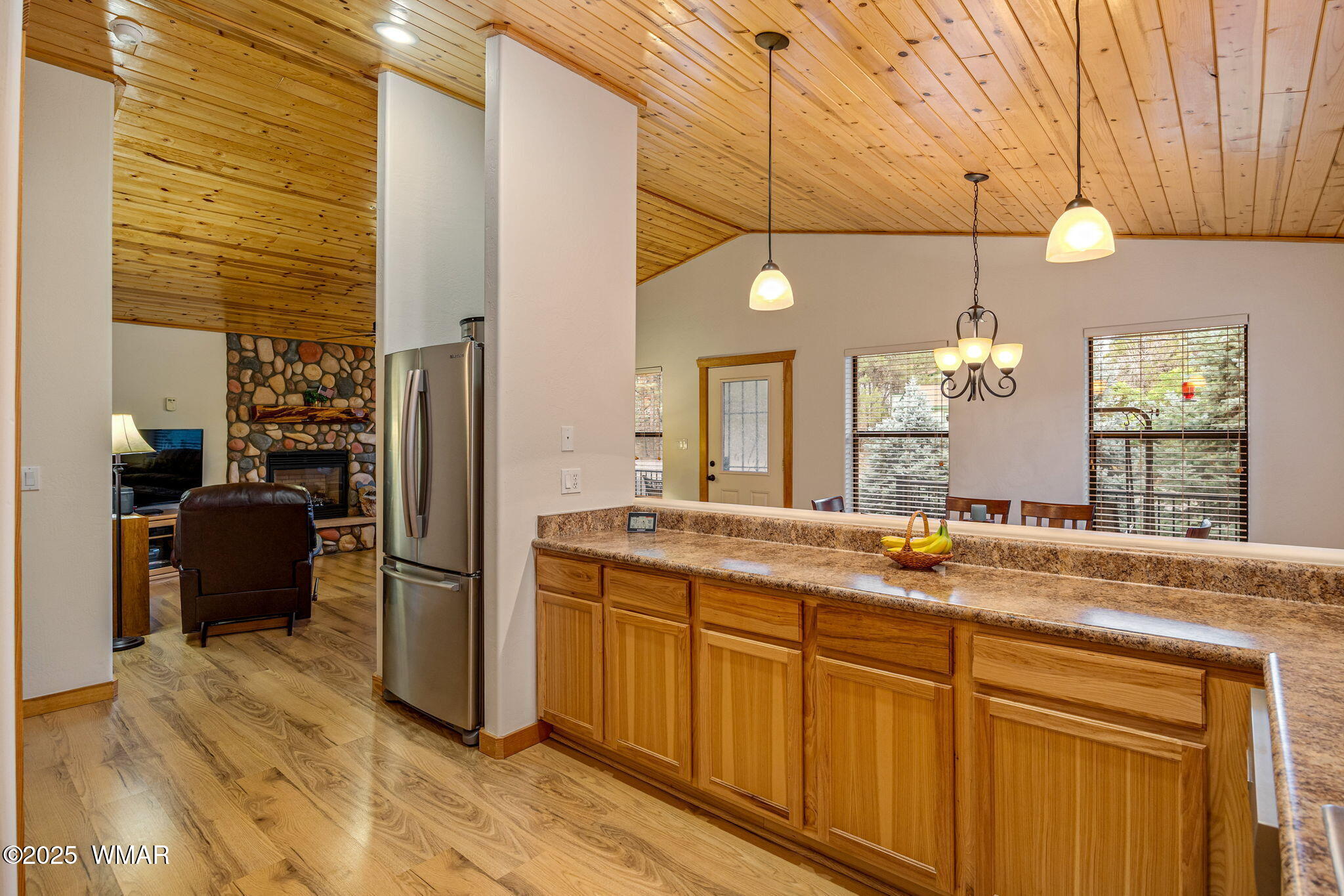 3142 Ranch Road Overgaard, AZ 85933 - Photo 13 of 35 a kitchen with stainless steel appliances granite countertop a sink a stove and a refrigerator