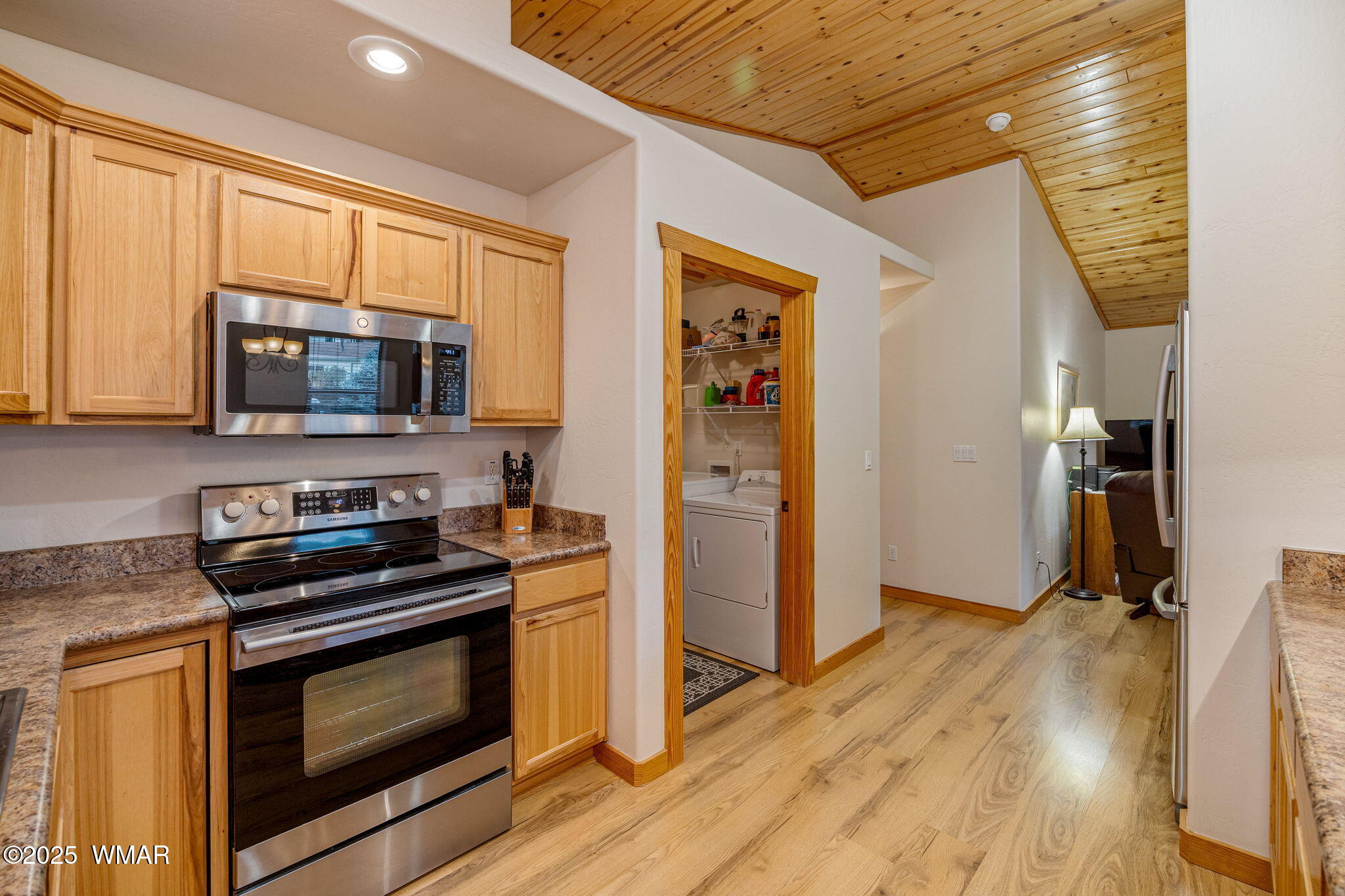 3142 Ranch Road Overgaard, AZ 85933 - Photo 14 of 35 a kitchen with granite countertop a stove and a microwave