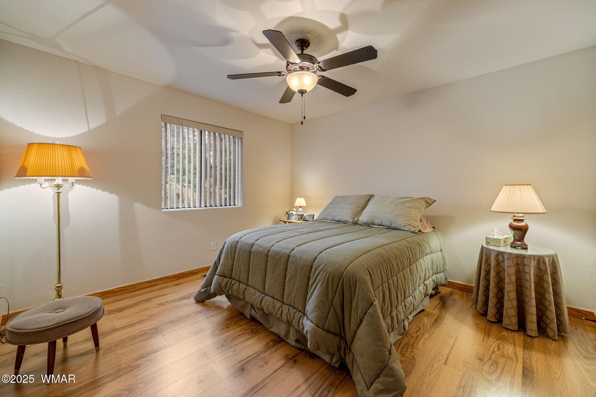 3142 Ranch Road Overgaard, AZ 85933 - Photo 18 of 35 a bedroom with a bed and wooden floor