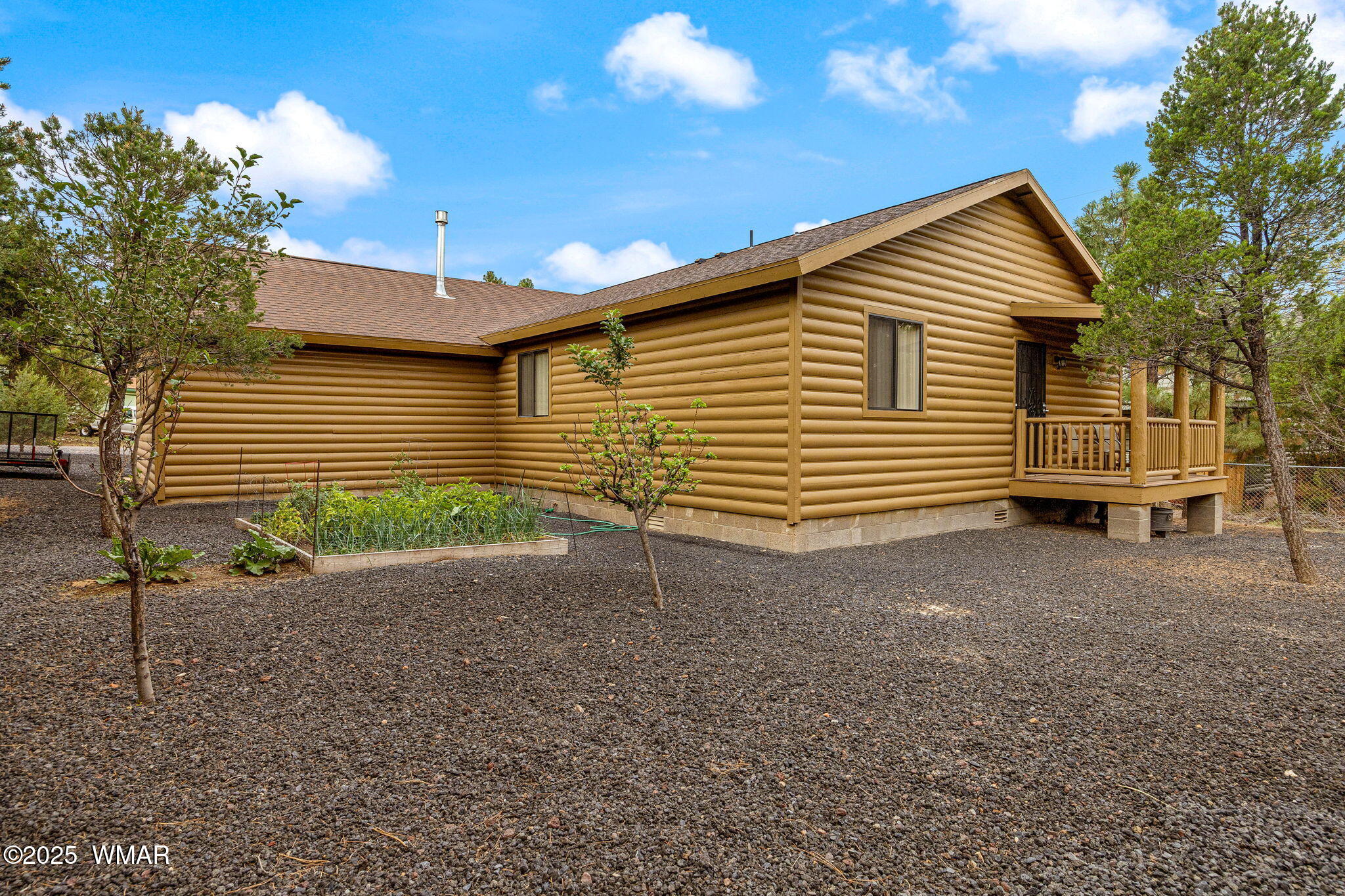 3142 Ranch Road Overgaard, AZ 85933 - Photo 27 of 35 a view of a house with a backyard