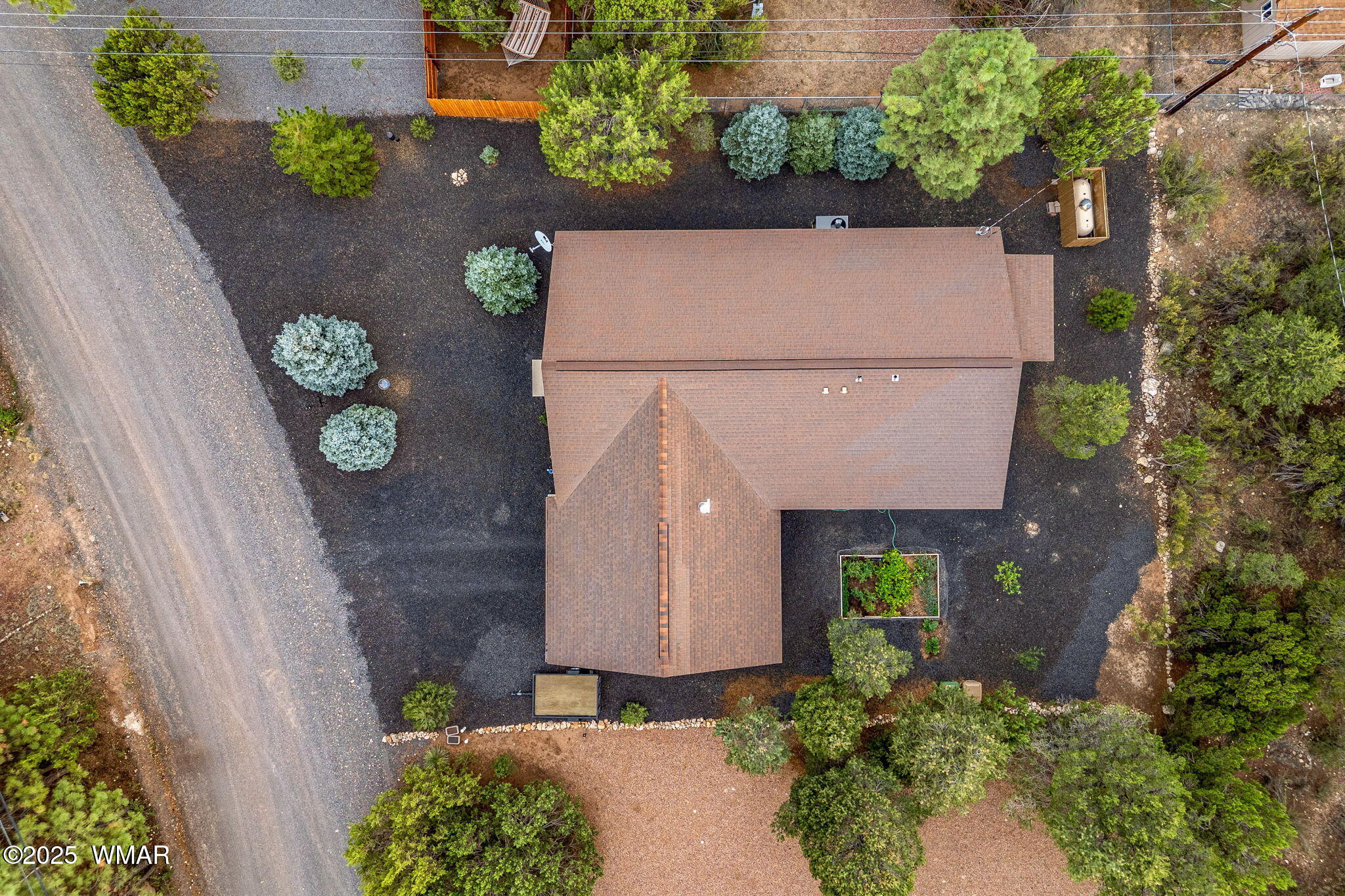 3142 Ranch Road Overgaard, AZ 85933 - Photo 30 of 35 a potted plant sitting in front of a house