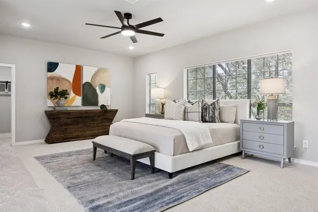 a bedroom with a bed and window