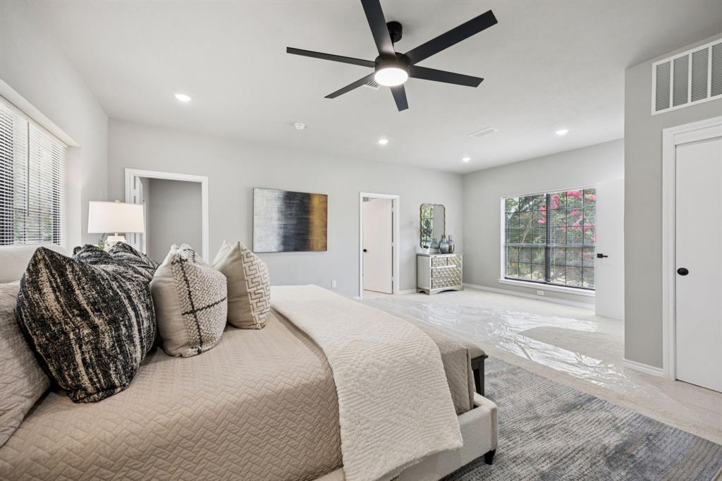 10 Chisholm Trail Lucas, TX 75002 - Photo 14 of 40 a spacious bedroom with a large bed and a window
