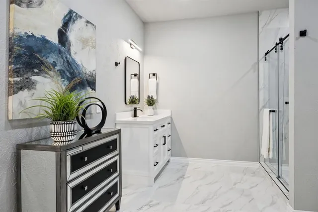 a view of a hallway to closet and utility room