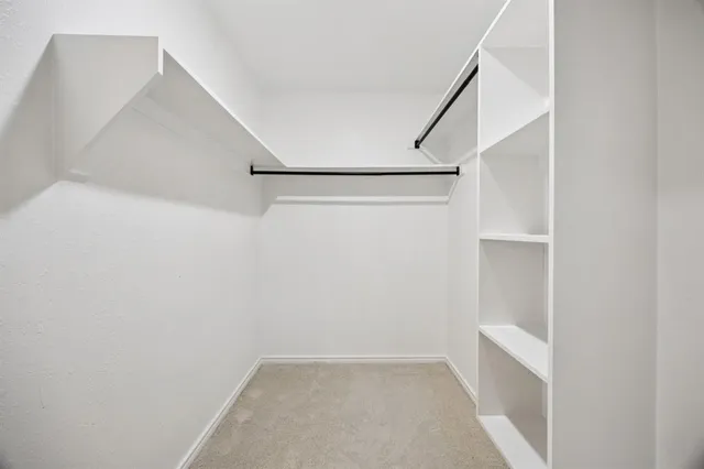 a view of an empty walk in closet