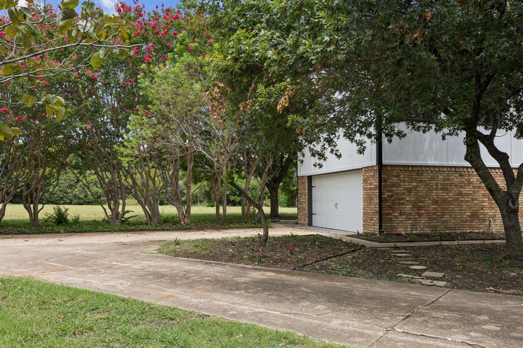 10 Chisholm Trail Lucas, TX 75002 - Photo 36 of 40 a view of a house with a yard