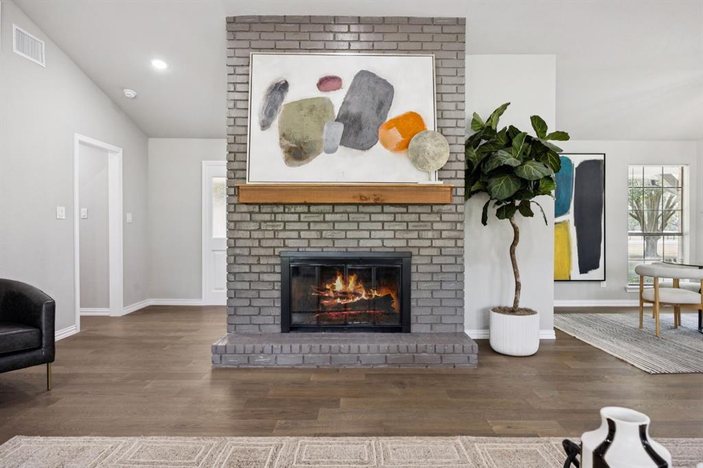 10 Chisholm Trail Lucas, TX 75002 - Photo 4 of 40 a living room with furniture and a fireplace