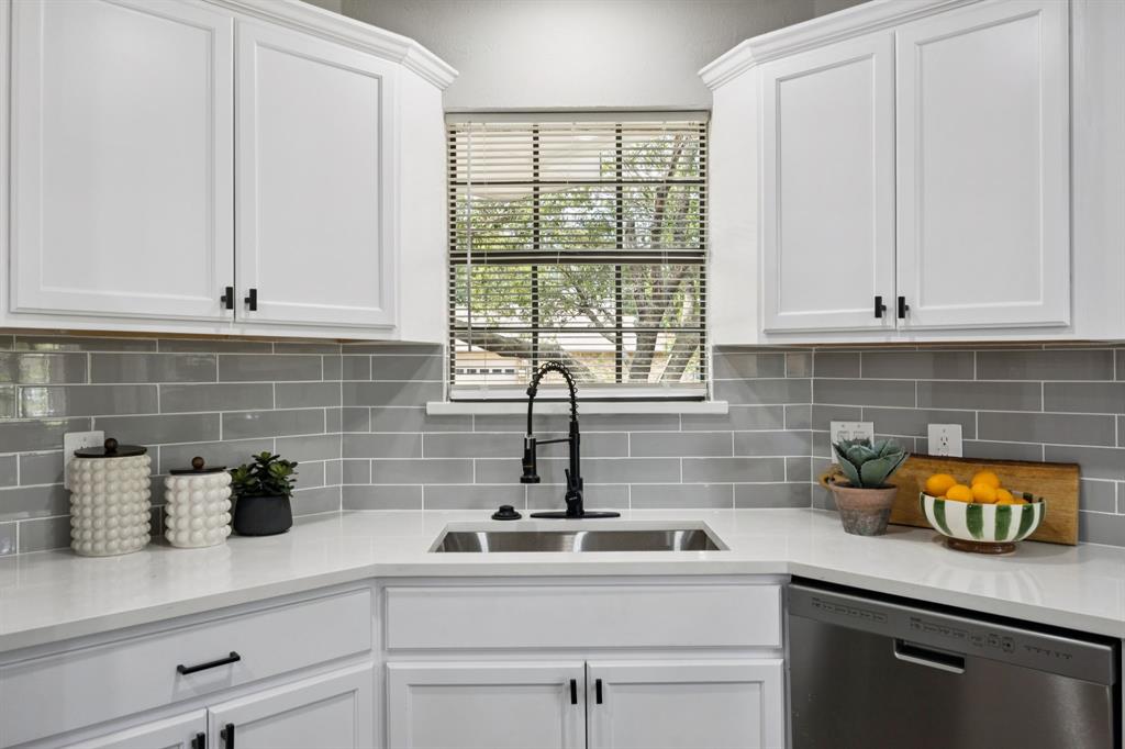 10 Chisholm Trail Lucas, TX 75002 - Photo 8 of 40 a kitchen with stainless steel appliances white cabinets and a sink