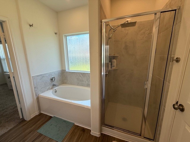 1745 Woolsey Way Leander, TX 78641 - Photo 14 of 20 a bathroom with a bathtub and a shower